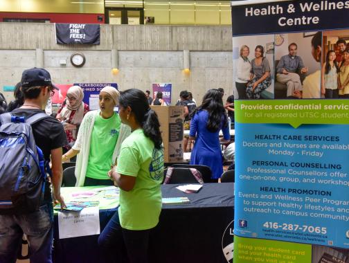 Group of students at a Health and Wellness information booth 