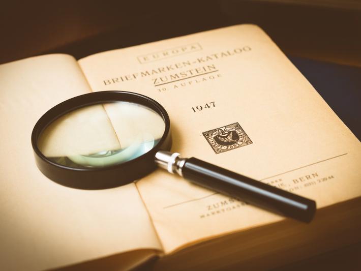 magnifying glass on a book