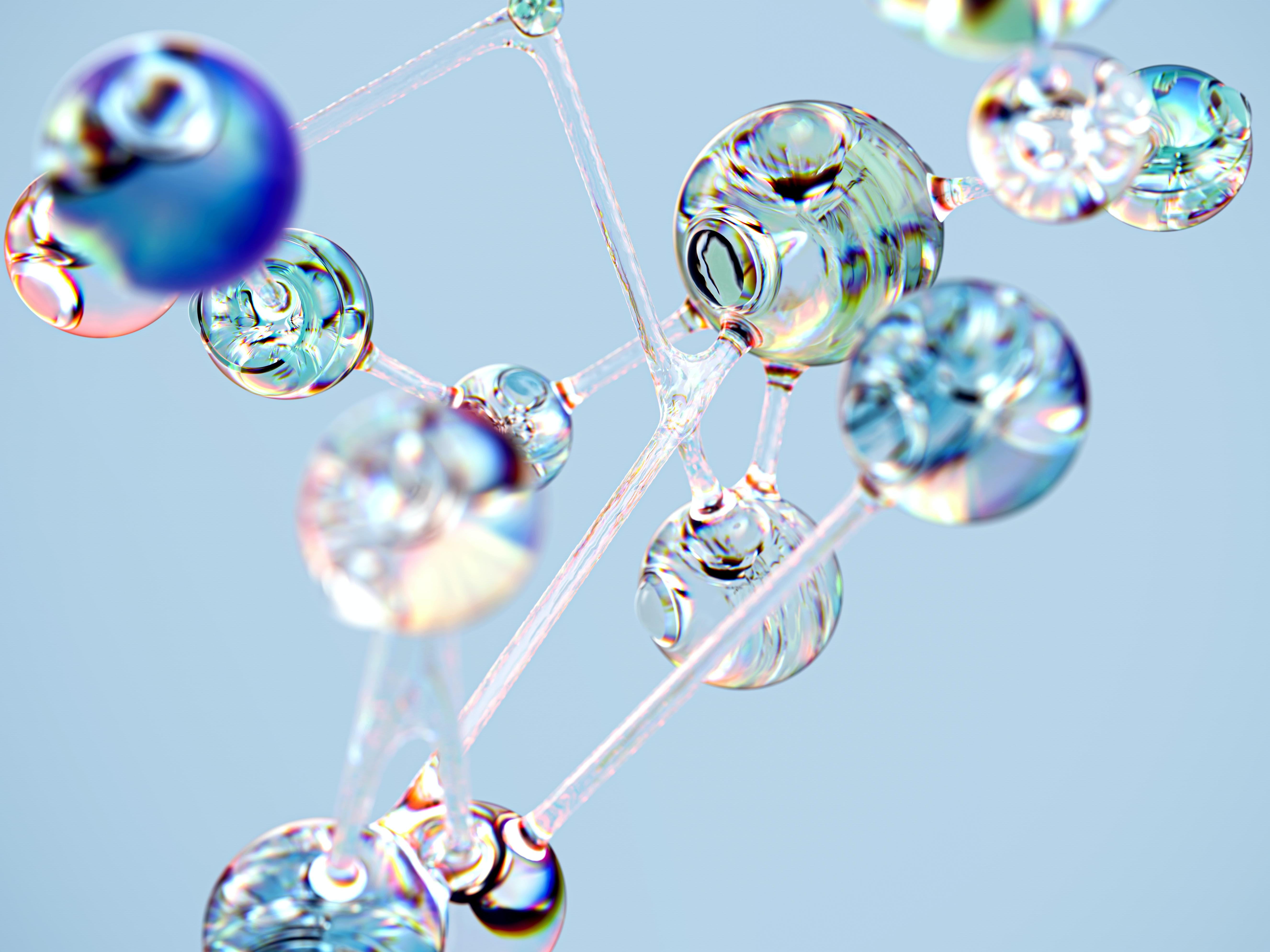 Decorative image: delicate balls of coloured glass connected together.